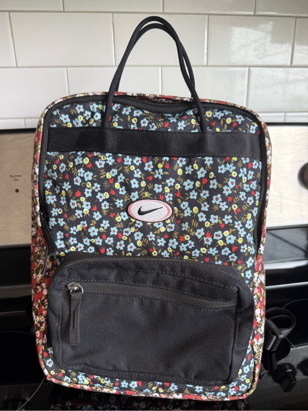 Vintage Nike Black Floral Pattern Backpack with Light Blue Accents